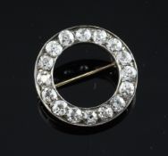 An early 20th century gold, silver and diamond open target brooch, set with sixteen old cut