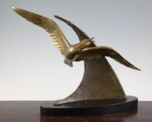 E.Guy. An Art Deco bronze figure group of a seagull and a sail, on a dual marble base, signed, 17in.