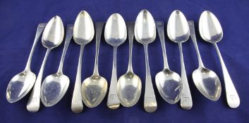 Twelve George III and later Old English pattern table spoons, with engraved armorial, various