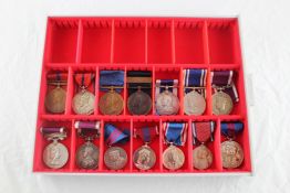 A collection of 14 assorted Jubilee and Long Service medals Starting Price: £160