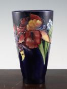 A Moorcroft `Orchid` conical shaped vase, c.1955, on cobalt blue ground, inscribed `W.M` mark,