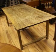 A 19th century country oak rectangular dining table, with plank top and H frame stretcher base, L.