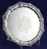 A late George II silver waiter, of shaped circular form, with shell and gadrooned border and
