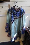 A Chinese embroidered silk lady`s summer robe, the Eau de nil ground with brocaded flowers,