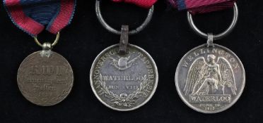 An unnamed Waterloo medal and a Hanovarian medal for Waterloo the former with iron clip and split