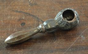 A 19th century treen leaf carved nutcracker, with shaped octagonal handle, 6.5in. Starting Price: £