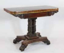 A Victorian mahogany folding card table, with four central cluster columns and platform base on