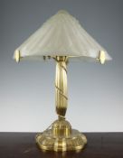 An Art Deco brass table lamp, with a hexagonal shape frosted glass shade, 20in. Starting Price: £