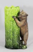 A large Bretby pottery novelty `bear` stickstand, late 19th century, modelled as a green glazed tree