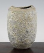 Chris Carter (1945-). A stoneware ovoid vase, with pitted ochre and grey glaze, impressed `CCP`