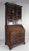 A 19th century and later mahogany bureau bookcase, with astragal glazed doors and bracket feet, H.
