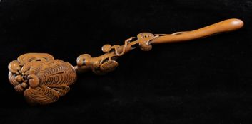 A Chinese boxwood ruyi sceptre, the head and stem carved in high relief with lingzhi fungus, 17.