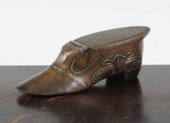 A 19th century walnut shoe shaped snuff, with brass pique decoration, 4.5in. Starting Price: £80