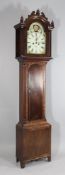 An early 19th century mahogany eight day longcase clock, the 12 inch arch painted dial with