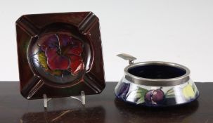 A Moorcroft `Wisteria` ashtray and `Hibiscus` ashtray, c.1955; the first on a dark to pale blue