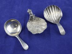 A Victorian silver caddy spoon, by George Unite, the fluted bowl embossed with flowers and foliate