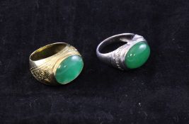 Two cabochon jadeite set dress rings, sizes O & R. Starting Price: £960