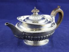 A George III demi fluted silver bachelor`s teapot, of circular form, with gadrooned borders, William