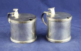 Two 20th century silver drum mustards, with reeded borders and scroll thumbpieces, Hunt & Roskell
