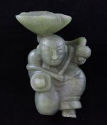 A Chinese green jade figure of a boy holding aloft a lotus leaf, 4.4in. Starting Price: £80