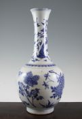 A Chinese blue and white bottle vase, 19th century, painted with lotus, bamboo, hydrangea and