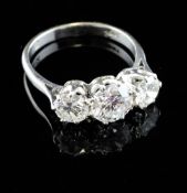 An 18ct white gold three stone diamond ring, total diamond weight approximately 1.80ct, size P.