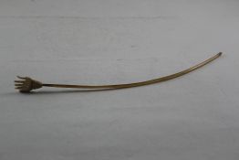 An Indian ivory and horn back scratcher, the terminal modelled as a hand, 14.75in. a.f. Starting