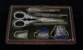A 19th century necessaire set, with various unmarked silver needlework tools, together with