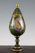 A 19th century Bohemian green glass and gilt scroll decorated pear shaped pedestal vase and cover,