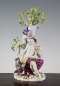 A Meissen group of a classical maiden, early 20th century, modelled seated next to a monkey and a