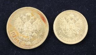 A cased Russian 1899 5 ruble gold coin and 10 ruble gold coin.