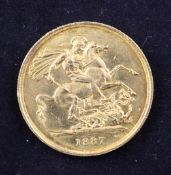 A cased Victorian 1887 £2 gold coin, (EF).