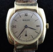 A gentleman`s stylish 1930`s 9ct gold Rolex cushion cased manual wind wrist watch, with shaped