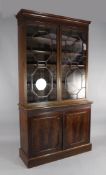 A 19th century mahogany bookcase, with two astragal glazed doors over two cupboard doors, W.4ft 1in.