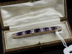 A gold amethyst and gem set bar brooch, with engraved setting, 2.75in.