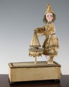 A 19th century French musical automaton by Renou, modelled as a female magician standing at a