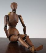 A French carved wood artist`s lay figure, with brass joints and manufacturers stamp verso, 20in.