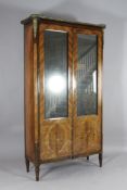 A 19th century French marquetry inlaid kingwood vitrine, with two mirrored doors enclosing