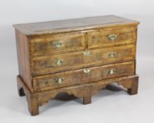 An 18th century and later walnut mule chest, with dummy drawers and single base drawer, on bracket