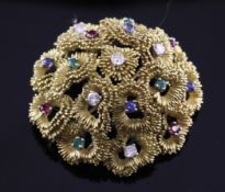 A 1950`s/60`s textured gold and multi gem set brooch, of domed form, in Wartski box, 1.75in.