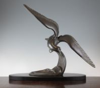 Irenee Rochard (1906-1984). A bronzed metal Art Deco figure of a tern swooping over a wave, on