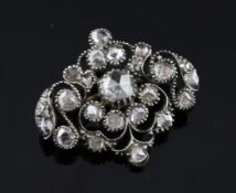 An early 19th century silver and diamond cluster brooch, of lozenge shape, set with old mine cut