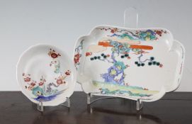Two Japanese Kakiemon dishes, the first petal lobed saucer dish, c.1700, painted with a bird perched