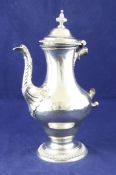 An early George III silver pedestal coffee pot, of pear form, with gadrooned borders and acanthus
