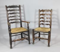 A set of eight late 19th century rush seat ladderback dining chairs, two with arms, six singles