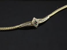 A 20th century 18ct gold, diamond, emerald and ruby set bracelet, with central diamond shaped motif,