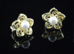 A pair of 18ct gold and cultured pearl ear clips by Mikimoto, of flowerhead design, in Mikimoto