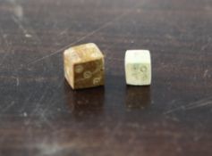 Two Roman bone dice, c.2nd century A.D., larger stained brown, 0.4in.