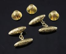 A pair of Edwardian 18ct gold torpedo shaped cufflinks, with chased decoration, together with a