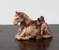 A Chinese small soapstone group of a man and a recumbent horse, Kangxi period, with some